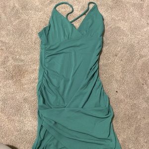 Green tight fitting mini dress